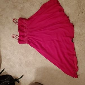 Red Knee length asymmetrical hem dress.